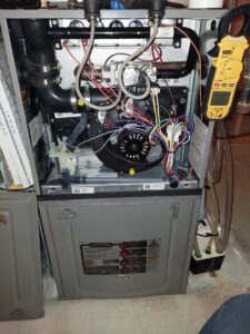 Completing a furnace maintenance in Carlsbad Springs Ottawa.